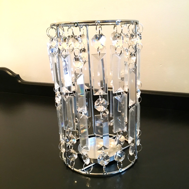 Candle holder transformed into lighting fixture