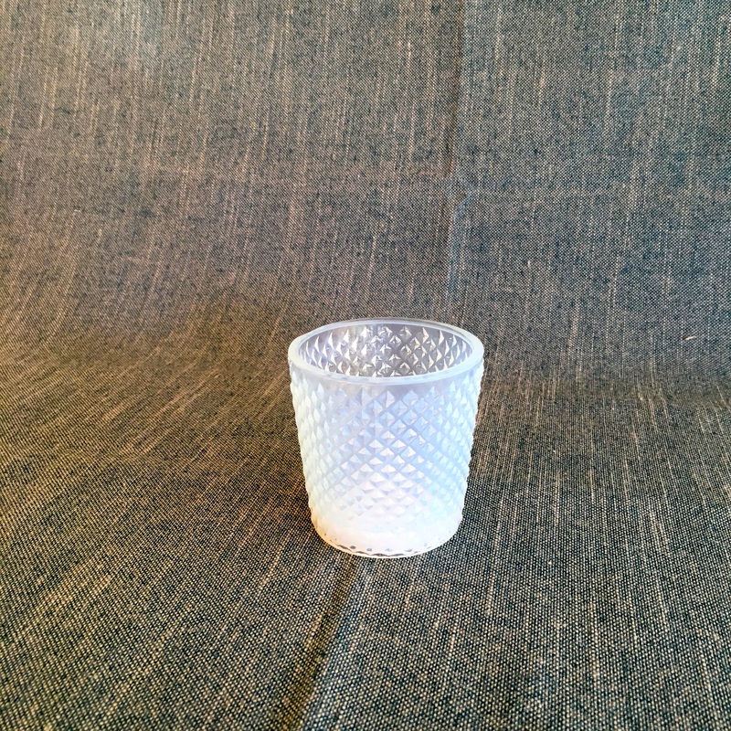 small white glass votive