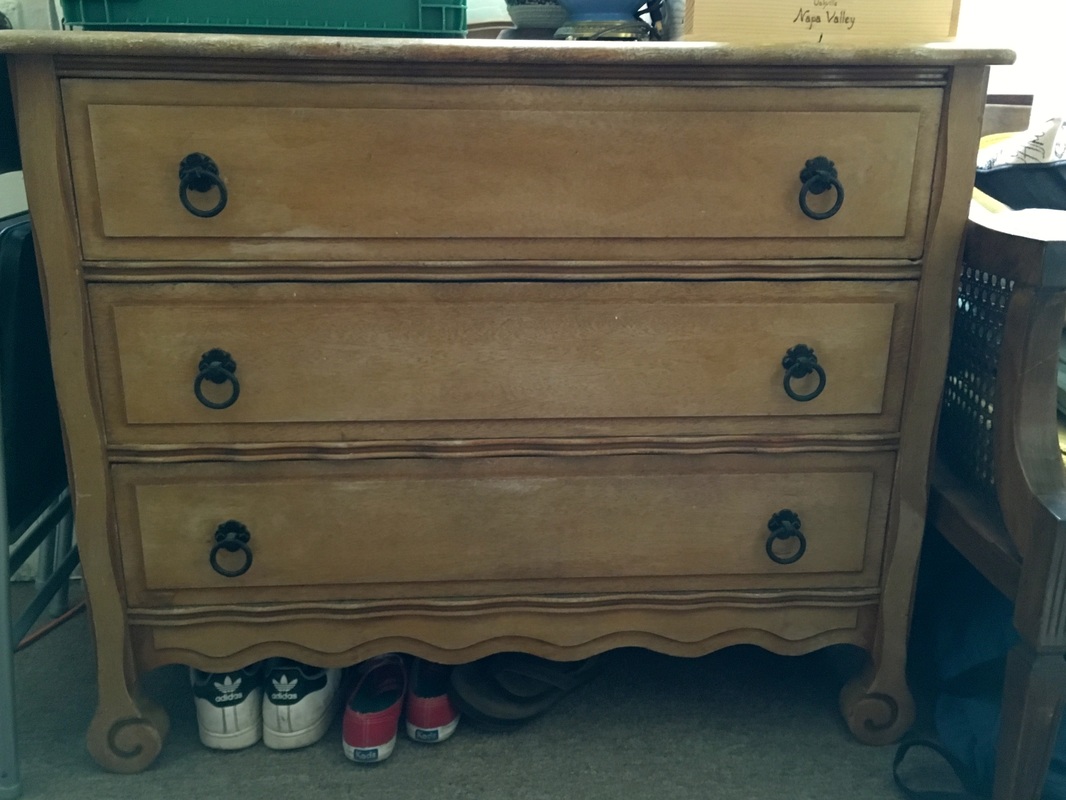 vintage wood dresser with swirly details