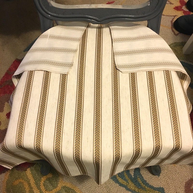 upholster around the back arms of a chair