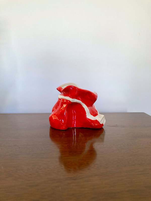 Bring some Christmas holiday charm to your home with this vintage ceramic red Santa bag flower pot. The bottom is marked M. Wyman December 25, 1954.