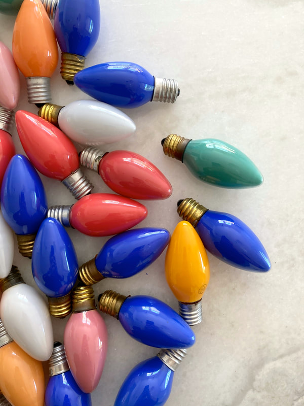 Bring some Holiday Twinkle and Charm to your home with these vintage multi-colored exterior string light bulbs. Set of 52 in teal, blue, orange, red, white, and pink. Some are marked GE others are unmarked. Not sure if they actually work but are great in a bowl as coffee table or dining table decor or for crafts like a wreath or place cards..