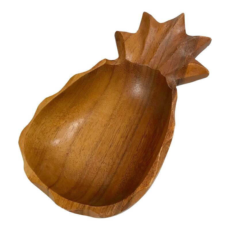 Great Monkey Pod wood bowl in the shape of a Pineapple! The sign of welcome and hospitality place one of these by your front door to catch loose change, keys or mail, use bedside or on your vanity to hold jewelry or on a table to serve nuts and candies. Excellent vintage condition with wear consistent to age. Has been given a coat of food-grade mineral oil. 5ʺW × 2ʺD × 9ʺH