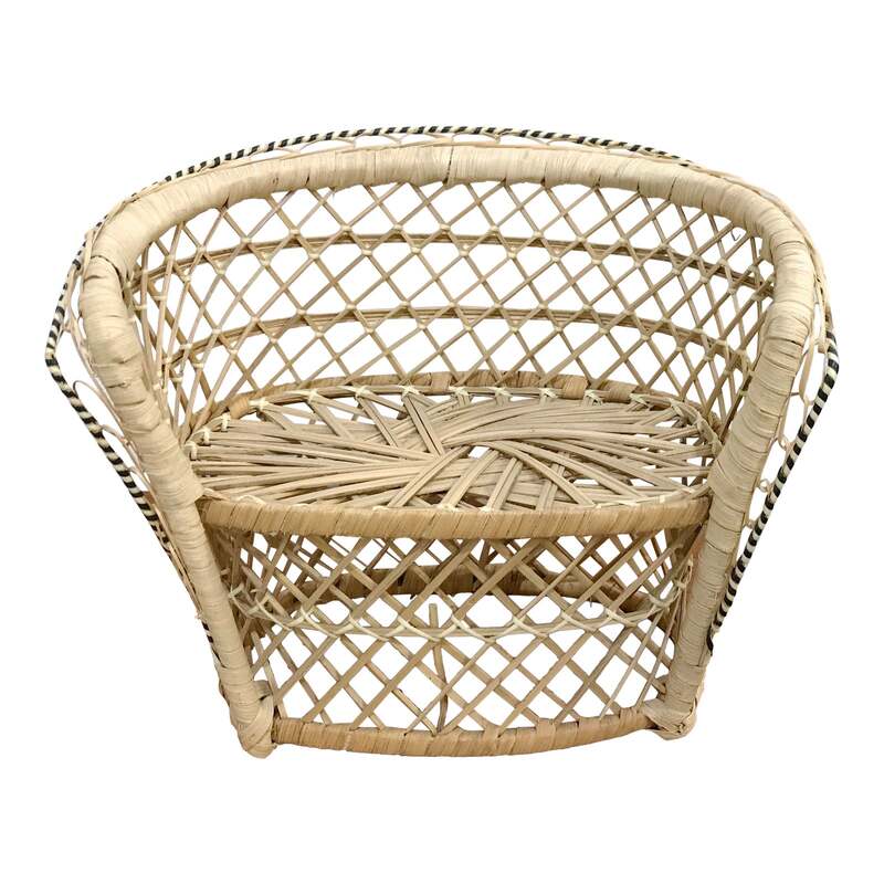 A delightful miniature Rattan Peacock Loveseat Chair. Just like the large scale chairs only smaller and perfect for plants or teddy bears! The rattan is accented with a black and white twist detailing around the edge. 9.5ʺW × 5.75ʺD × 8.5ʺH
